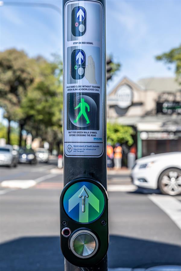 BRAUMS Touch-Less Pedestrian Push Button with public awareness infographic, installed in Norwood, SA