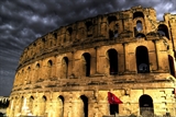 Close up photo of the Coloseum in Rome at night